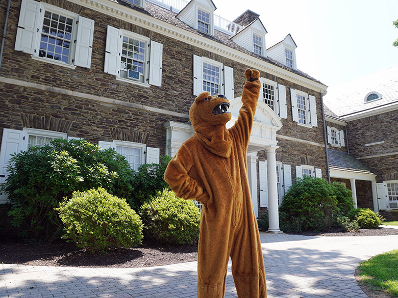 Triumphant mascot in front of Hayfield House