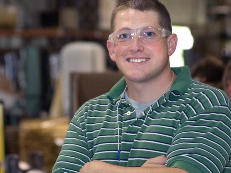 a professional wearing safety glasses in an industrial work environment